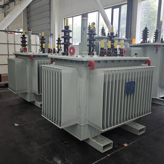 Multiple finished oil immersed distribution transformers in production workshop